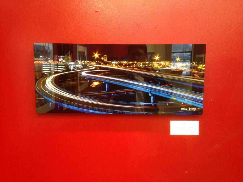 Close-up of a fine art metal print showcasing vibrant colors and luminous depth.