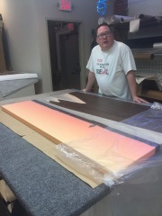 Mike Dooley puts the finishing touch on a large Conimicut Lighthouse canvas at a Warwick print house, bringing his iconic Rhode Island landscape to collectors. Mike Dooley puts the finishing touch on a large Conimicut Lighthouse canvas at a Warwick print house, bringing his iconic Rhode Island landscape to collectors.