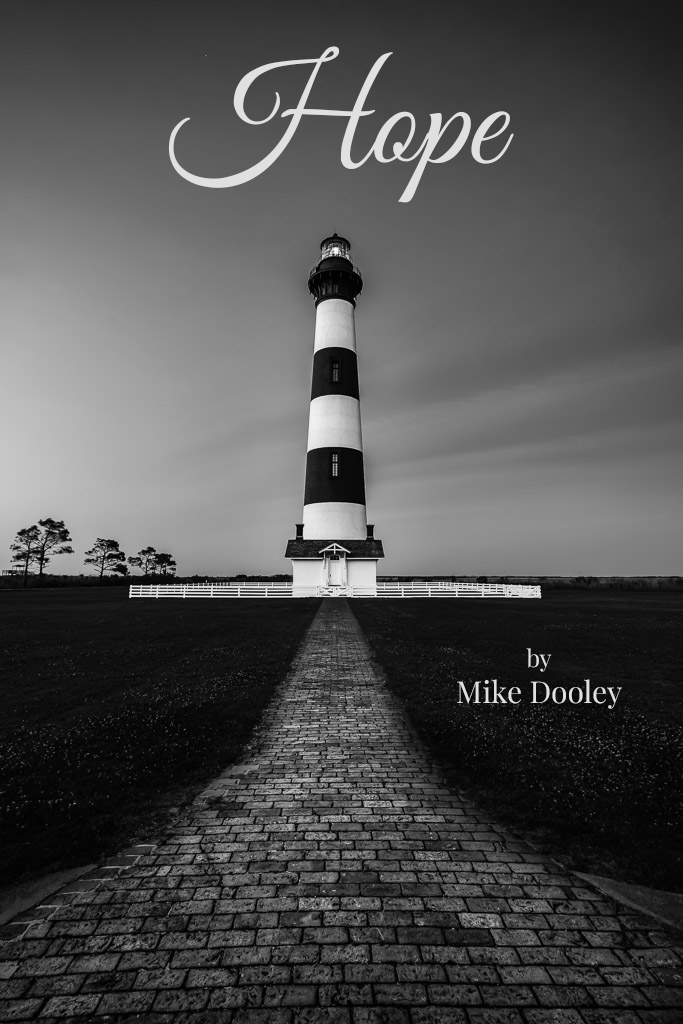Black and white photograph of Block Island Lighthouse with the word "HOPE" in large text across the top and "by Mike Dooley" at the bottom, representing the cover of the book Hope.