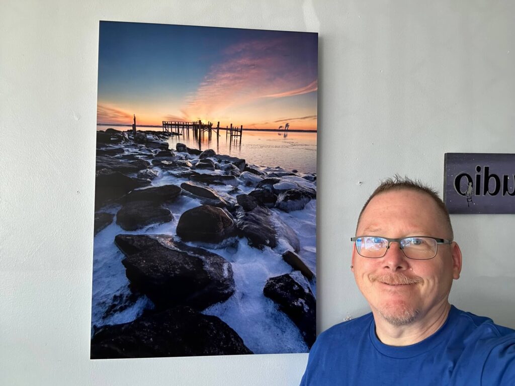Mike Dooley standing next to a 20x30" fine art metal print at the Through My Eyes book signing