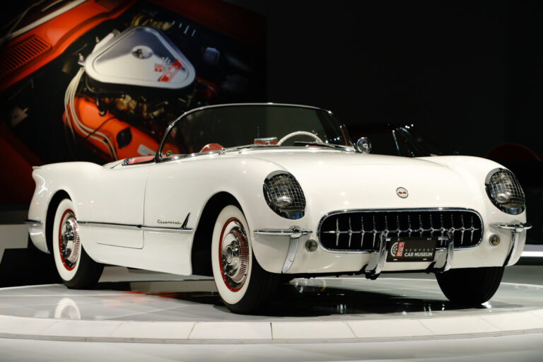1954 Chevy Corvette convertible with white body and red leather interior at the Newport Car Museum