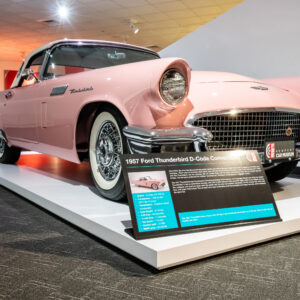 1957 Ford Thunderbird D-Code convertible in soft pink with white top at the Newport Car Museum, photographed as a fine art print by Mike Dooley.