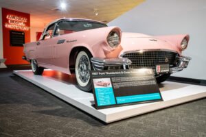 1957 Ford Thunderbird D-Code convertible in soft pink with white top at the Newport Car Museum, photographed as a fine art print by Mike Dooley.