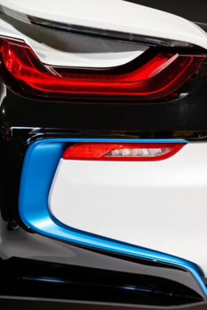 Close-up of the taillights of an electric BMW at the Newport Car Museum, photographed as a fine art print by Mike Dooley.