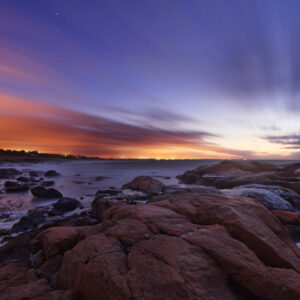 Streaked clouds across a starry sky before sunrise at Black Point, Narragansett