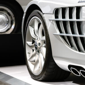 Side detail of a Mercedes showing engine compartment airflow and exhaust at the Newport Car Museum, photographed as a fine art print by Mike Dooley.
