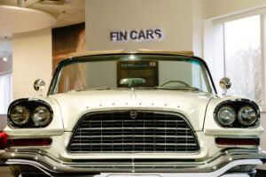 Chrome hood and grille of a vintage Chrysler 300 at the entrance to the Fin Cars exhibit, Newport Car Museum