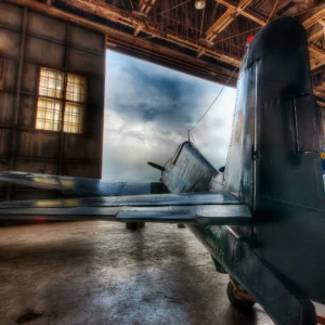 World War II Hellcat fighter aircraft resting on display, photographed as a fine art print by Mike Dooley.