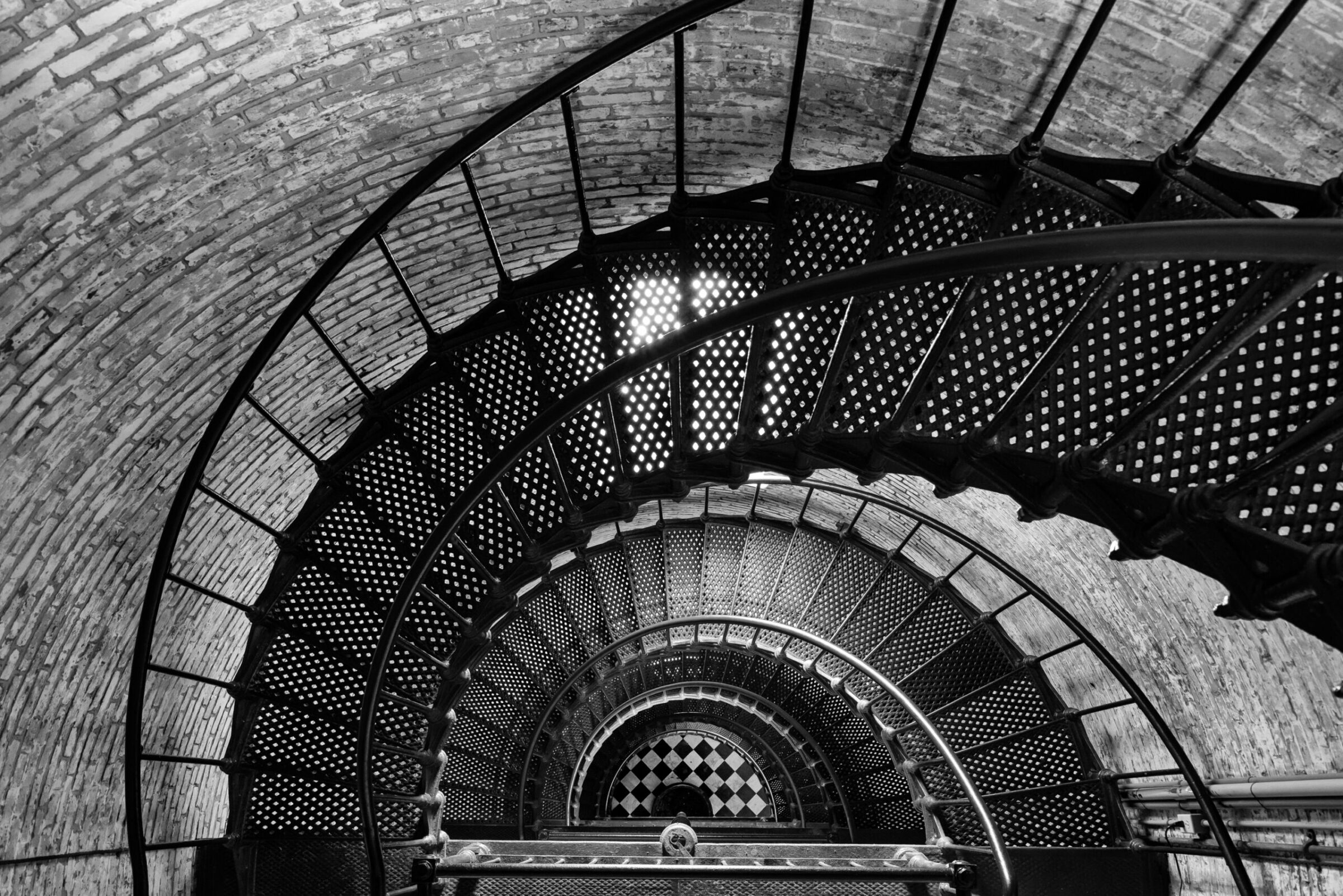 Looking straight down five flights of spiral stairs from the top of an Outer Banks lighthouse