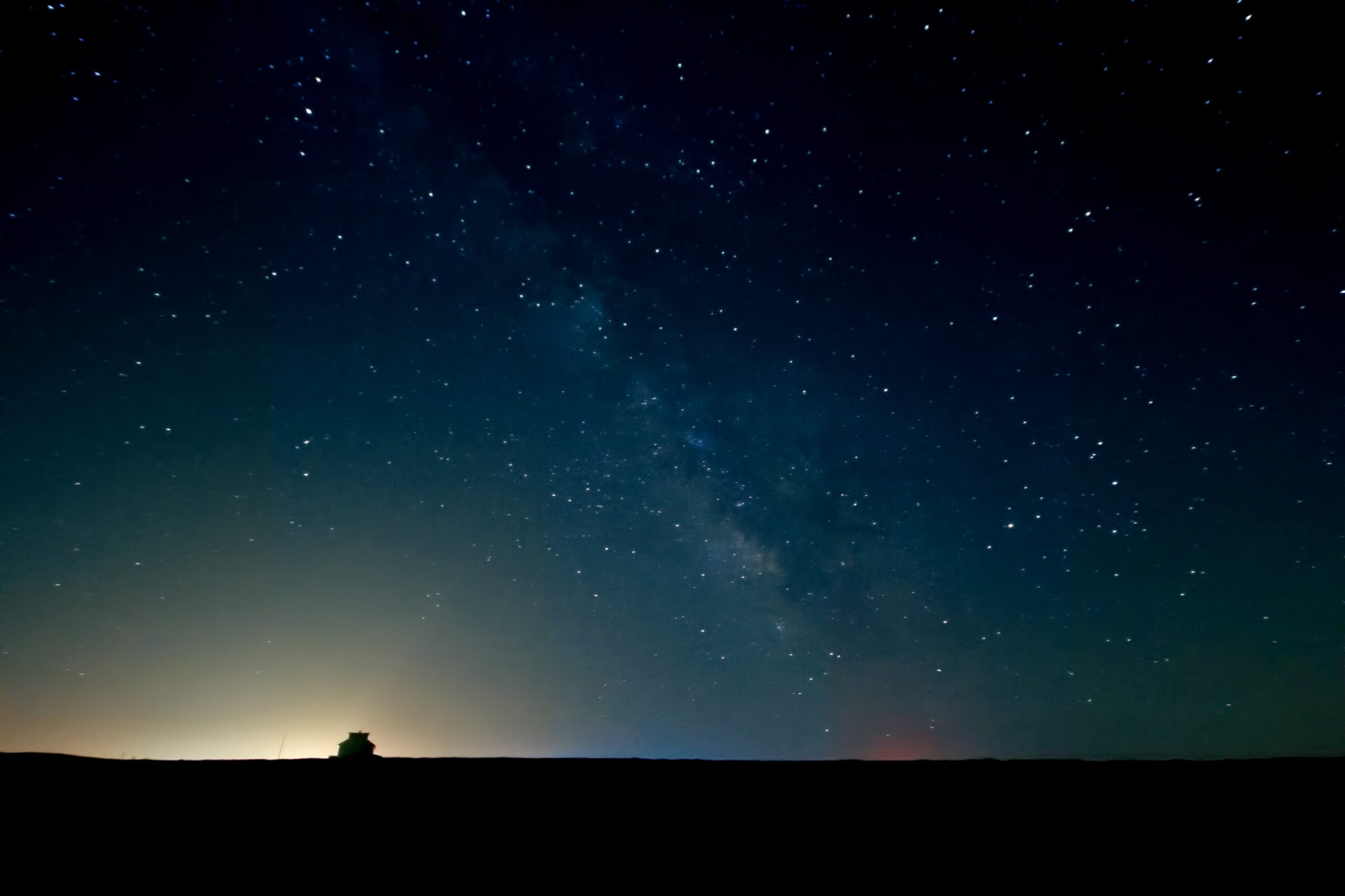 Milky Way over Station Race Point Coast Guard station in Provincetown Massachusetts at night