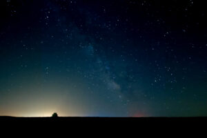 The Milky Way galaxy arching over Cape Cod at night, photographed as fine art by Mike Dooley.