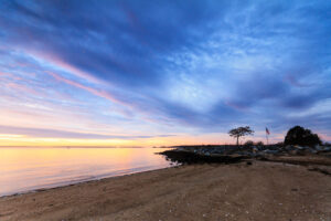 Sunrise over Conimicut Beach and Narragansett Bay from Conimicut Point Park in Warwick, Rhode Island, photographed by Mike Dooley.