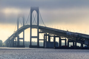 Newport Bridge partially obscured by fog on a summer evening, photographed by Mike Dooley.
