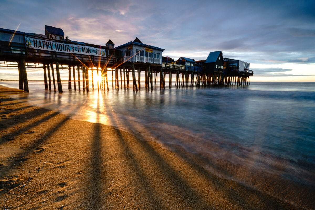 Sunrise through the pilings of the Old Orchard Beach Pier, Maine