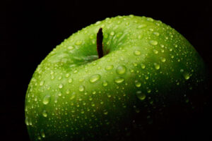Close-up of a single apple, captured as a fine art photograph by Mike Dooley.
