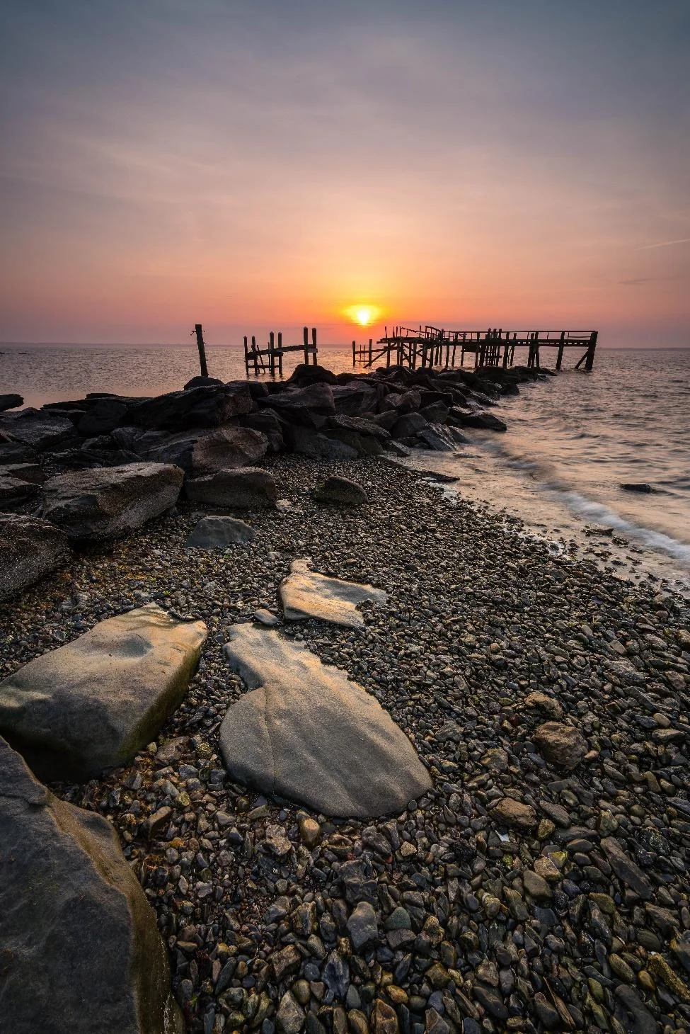 The Stranger: A Quiet Sunrise Behind Rocky Point Pier