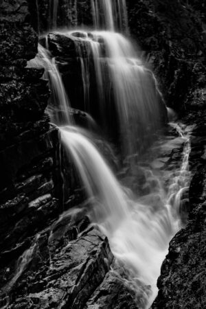 Black and white long exposure of Avalanche Falls in Franconia Notch State Park, New Hampshire, by Mike Dooley