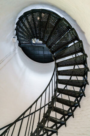 Spiral staircase winding up the inside of a lighthouse on North Carolina's Outer Banks