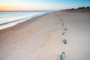 Footprints in the sand on an Outer Banks beach, North Carolina
