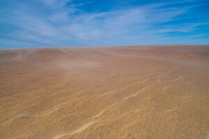 Wind-rippled sand and blue sky at Jockey's Ridge State Park, Outer Banks, North Carolina