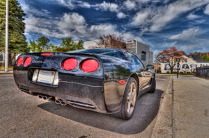 Black Corvette parked on a Fall River street, HDR fine art photograph by Mike Dooley