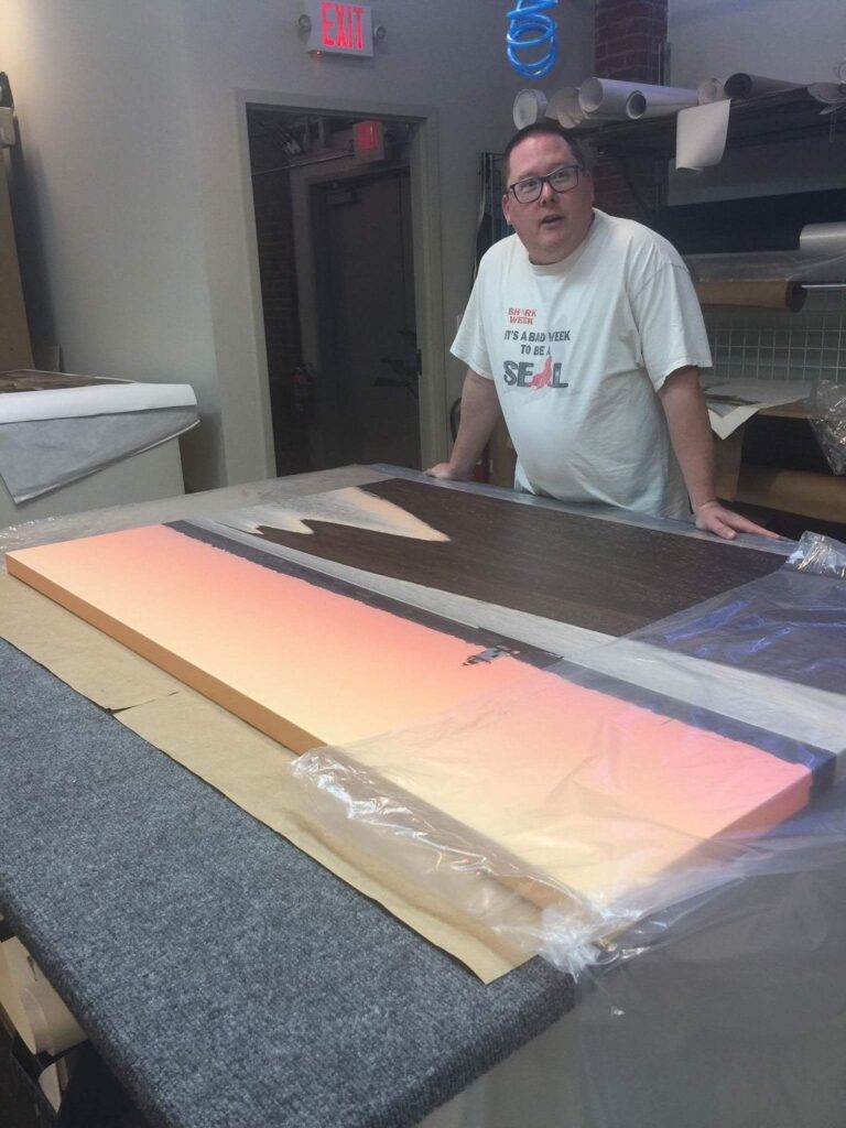 Mike Dooley signing a Conimicut Lighthouse canvas