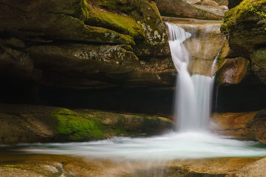 Long exposure of Sabbaday Falls dropping between mossy granite into a pool, White Mountains, New Hampshire, by Mike Dooley