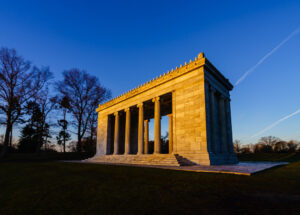 Stone columns of the Temple of Music glowing in sunrise light under a deep blue sky, Roger Williams Park, Providence, Rhode Island, by Mike Dooley
