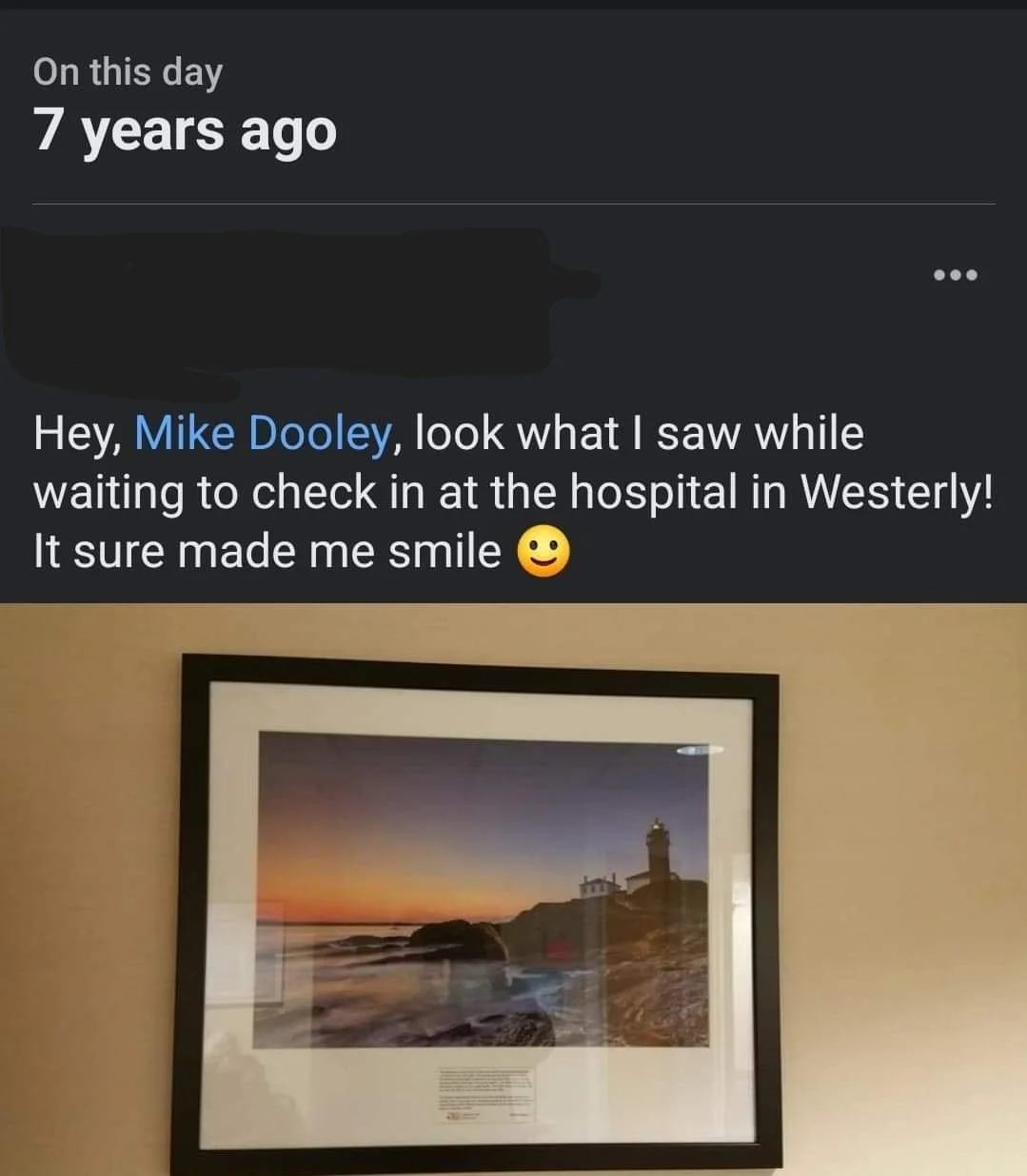 Message to Mike Dooley reading: look what I saw while waiting to check in at the hospital in Westerly, it sure made me smile, with a photo of his framed lighthouse print on the wall.